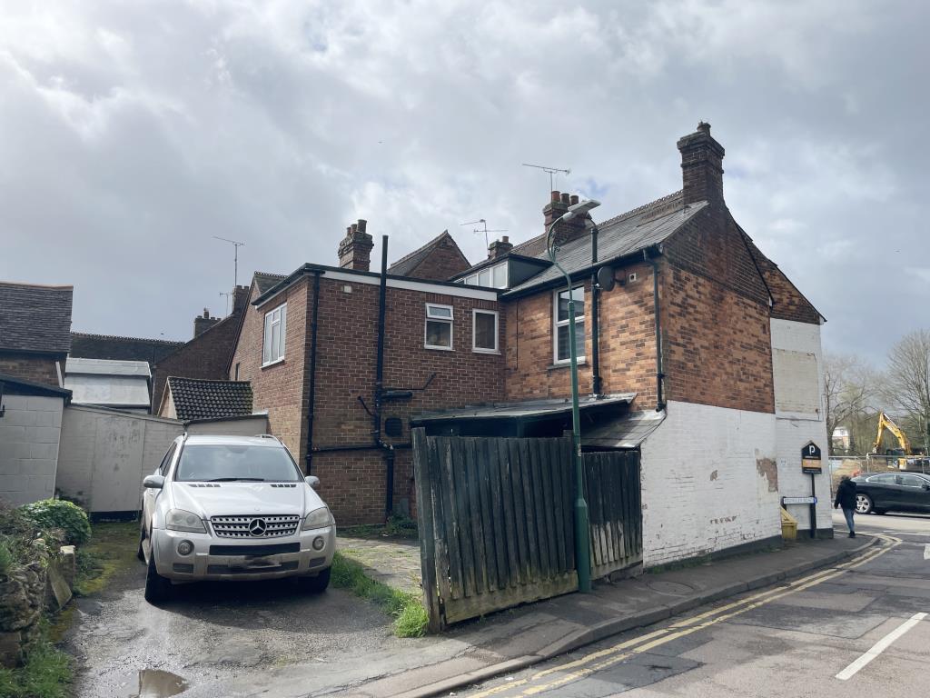Lot: 26 - RETAIL AND RESIDENTIAL PREMISES WITH ADDITIONAL PLANNING FOR THREE FLATS - rear view of view of retail, investment and development property
